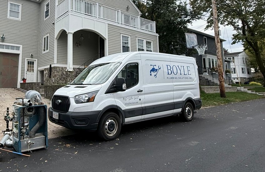 Boyle Plumbing Solutions branded service van onsite at a residential installation
